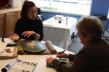 Jennifer Hain-Teper talks with visitor