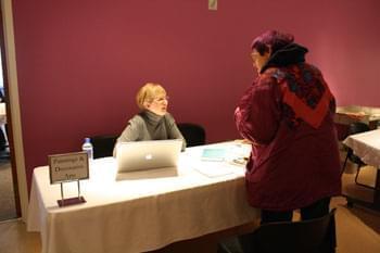 Kathleen Jones speaks with a visitor