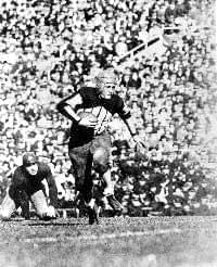 Red Grange running with football