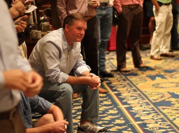 State Sen. Bill Brady listens to fellow candidates for governor address a meeting of top Republican leaders in Springfield. Responding to a dig by incumbent Democratic Gov. Pat Quinn, Brady made a point of wearing running shoes.