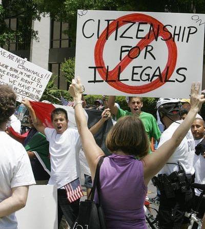 Protesters demonstrate in downtown Orlando, Fla., on May 1, 2006. Most news outlets have long abandoned the use of the term 