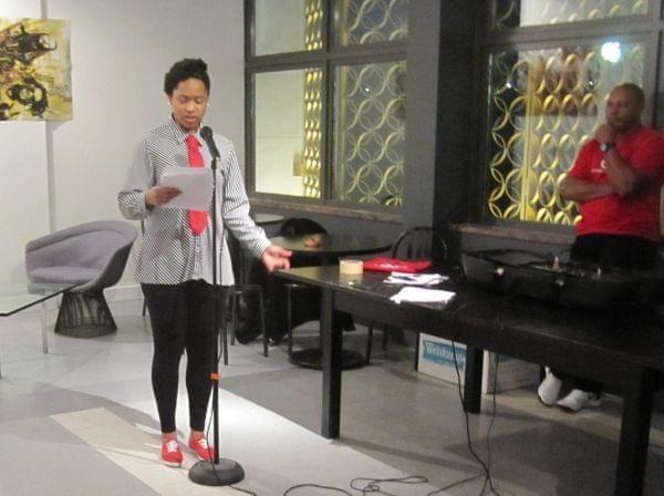 Coco Harmon reads some of her work, including a poem in honor of her mother, at the SPEAK Cafe.