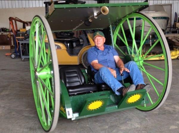 Larry Yoder showing off an earlier prototype of his solar powered buggy..