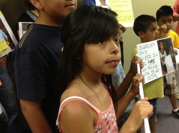 A group of children present the Father's Day card to U.S. Rep. Rodney Davis' staff.