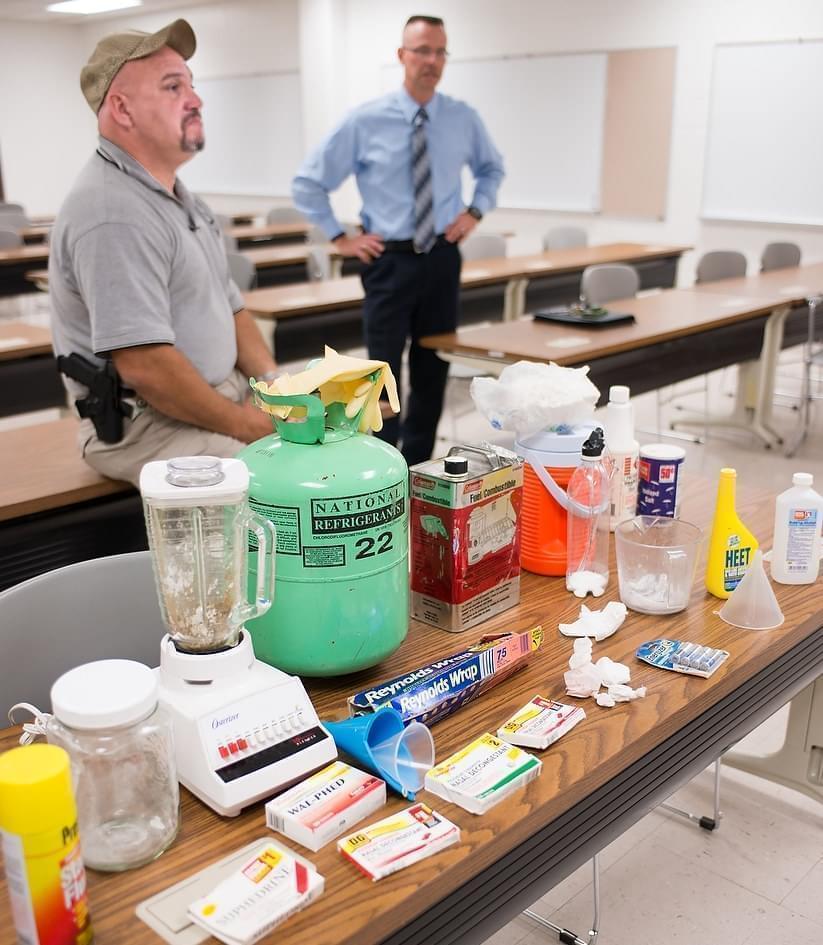 Vermilion County Sheriff's deputy Patrick Alblinger and Illinois State Police Master Sgt. Mike Atkinson (right) talk about the area's meth problem and show examples of lab components on Sept. 30, 2013.