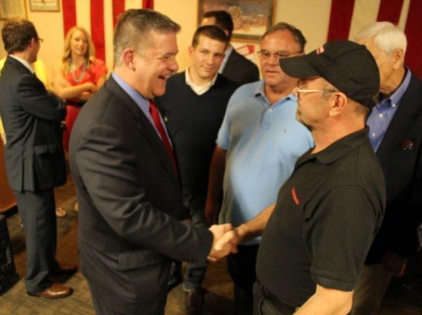 Illinois Treasurer Dan Rutherford (left) greets supporters Sunday in Springfield. He's making a three-day tour of Illinois to formally launch his campaign for governor.