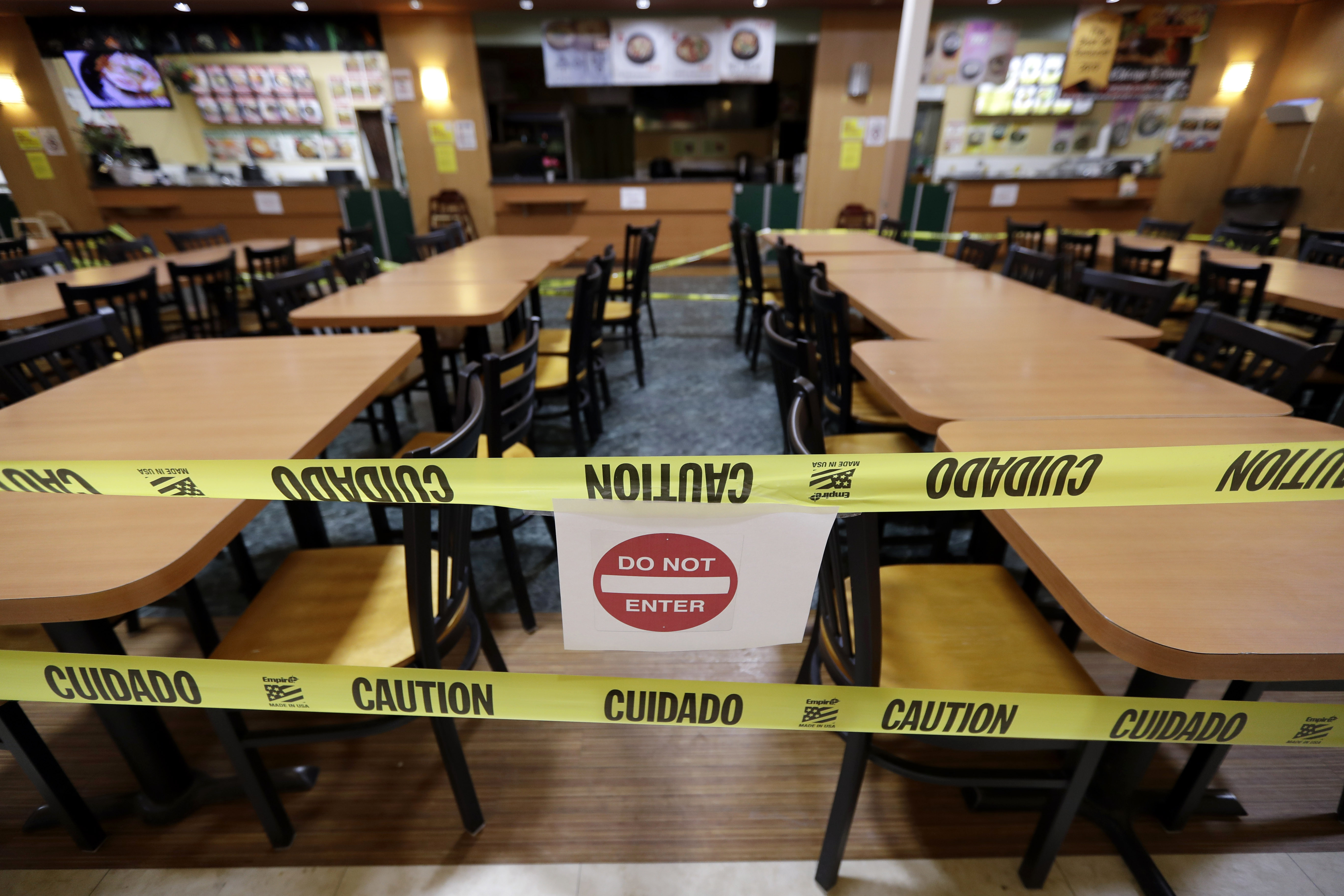 The seating area is closed-off at a food court in Assi Plaza during the coronavirus outbreak, Friday, April 3, 2020, in Niles, Ill. All bars, gyms, movie theaters, food courts to close, and restaurants are to move to drive-thru during the COVID-19 pandemic.