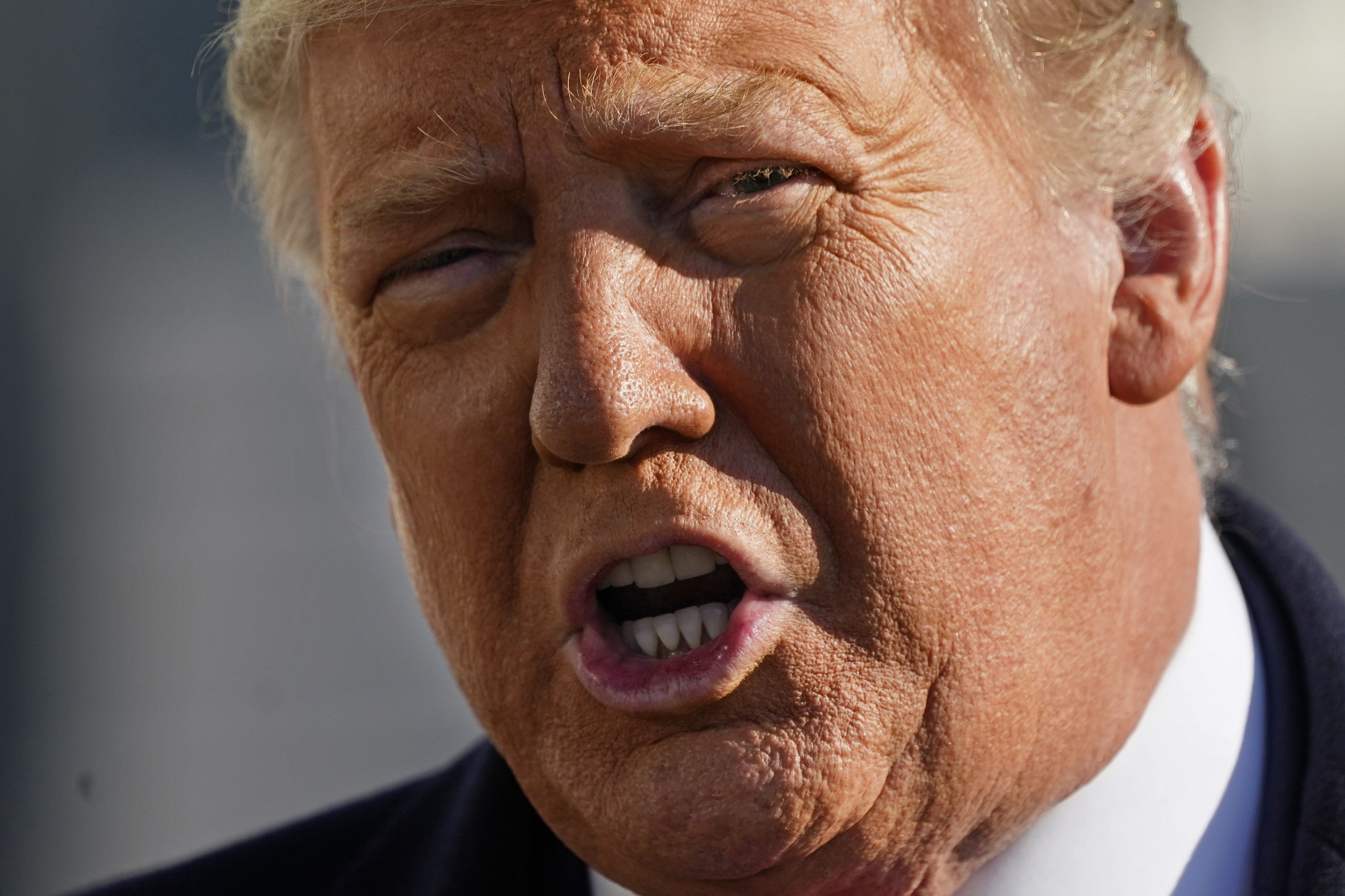 President Donald Trump speaks to the media before boarding Marine One on the South Lawn of the White House, Tuesday, Jan. 12, 2021, in Washington. The President is traveling to Texas.