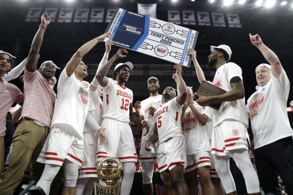 Members of Bradley celebrate after defeating Valparaiso 80-66 during an NCAA college basketball game in the championship of the Missouri Valley Conference men's tournament Sunday, March 8, 2020, in St. Louis.