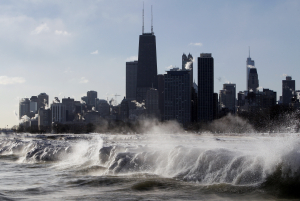 Jan. 27, 2014, file photo, ice forms as waves crash along the Lake Michigan shore in Chicago.