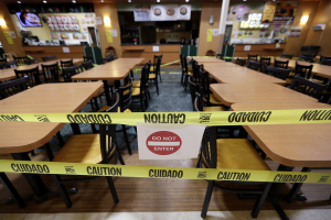 The seating area is closed-off at a food court in Assi Plaza during the coronavirus outbreak, Friday, April 3, 2020, in Niles, Ill. All bars, gyms, movie theaters, food courts to close, and restaurants are to move to drive-thru during the COVID-19 pandemic.