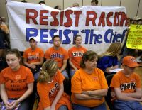 Supporters and opponents of University of Illinois' mascot listen at a board of trustees meeting Thursday, June 17, 2004 in Chicago.
