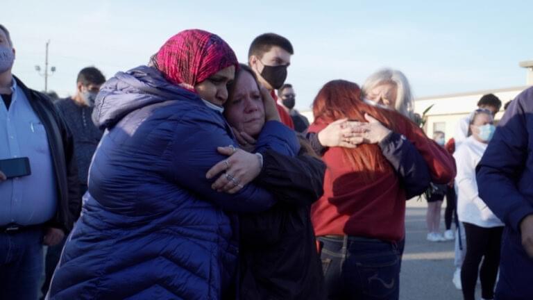 About 200 people gathered for a candlelight vigil to remember those who died in the mass shooting at a FedEx facility.