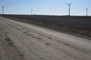 Wind turbines operate on rural road near Paxton