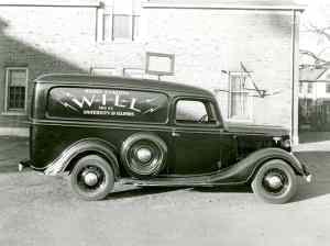 A 1930s-vintage WILL truck in front of the station