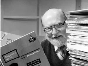 John Frayne behind a pile of LP records