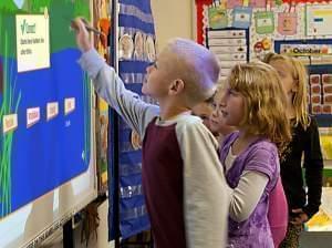 Students in Gibson City use a white board to play a learning game.
