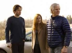  David Duchovny (Fox Mulder) and Gillian Anderson (Dana Scully) on set of the X-Files with creator Chris Carter.
