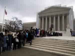  People wait in line outside the Supreme Court in Washington, Wednesday, Feb. 27,2013, to listen to oral arguments in the Shelby County, Ala., v. Holder voting rights case. 