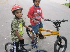 Mark Smith, 7, and his brother Tauryon Smith, 11, pose next to their bicycles in Champaign.
