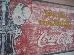 A Coca-Cola mural in Vicksburg, Miss., where the soda was first bottled in 1894. Mississippi's governor is expected to sign a bill that would prevent the regulation of soda portion sizes by counties or towns.