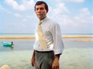 Mohamed Nasheed, the first democratically elected president of the Republic of Maldives, standing on the shore
