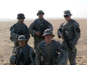 Eric (pictured on the far right) with friends in Kuwait in 2006 shortly before going to Iraq.
