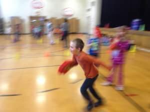 student at Wiley Elementary running during gym class