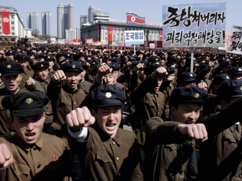 University students march through Kim Il Sung Square in downtown Pyongyang, North Korea, on Friday.