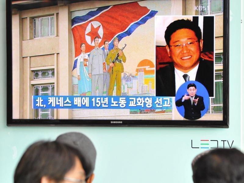 Passersby watch a local television broadcast in Seoul on Thursday showing a report on the sentencing of Kenneth Bae.