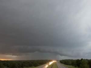 A tornado forms over I-40 as seen looking west from Indian Meridian Road in Midwest City, Okla. on Friday.