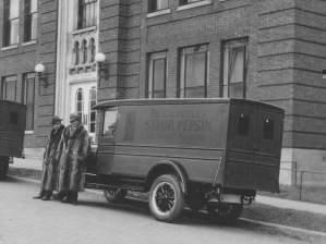 Two men stand in front of the Pepin Syrup Company in the 1920’s. 