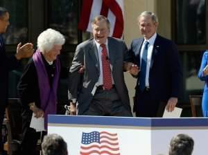 President Obama applauds as former first lady Barbara Bush and former President George W. Bush help President George H.W. Bush stand at the opening ceremony of the George W. Bush Presidential Library on April 25 in Dallas. Former first lady Laura Bus