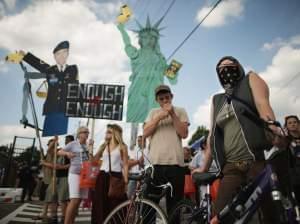 Supporters of U.S. Army Pfc. Bradley Manning protest his detention by marching around the perimeter and blocking the gates of Fort McNair in Washington, D.C., on the final day of closing arguments in his military trial Friday.