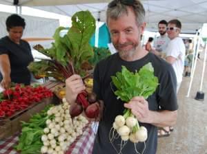 Mike Odette, chef and co-owner of Sycamore Restaurant, finds beets and turnips that will make tasty refrigerator pickles at the Columbia, Mo., farmers market.
