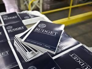 Copies of President Obama's proposed budget plan for fiscal year 2014 are prepared for delivery at the U.S. Government Printing Office in Washington in April 2013.