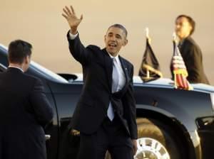 President Obama waves as he departs Love Field Airport after shaking hands with supporters Wednesday in Dallas.