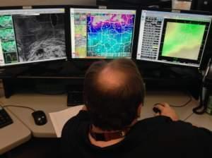 A meteorologist monitors weather conditions at the National Weather Service’s office in Lincoln, Ill. on Nov. 19, 2013.