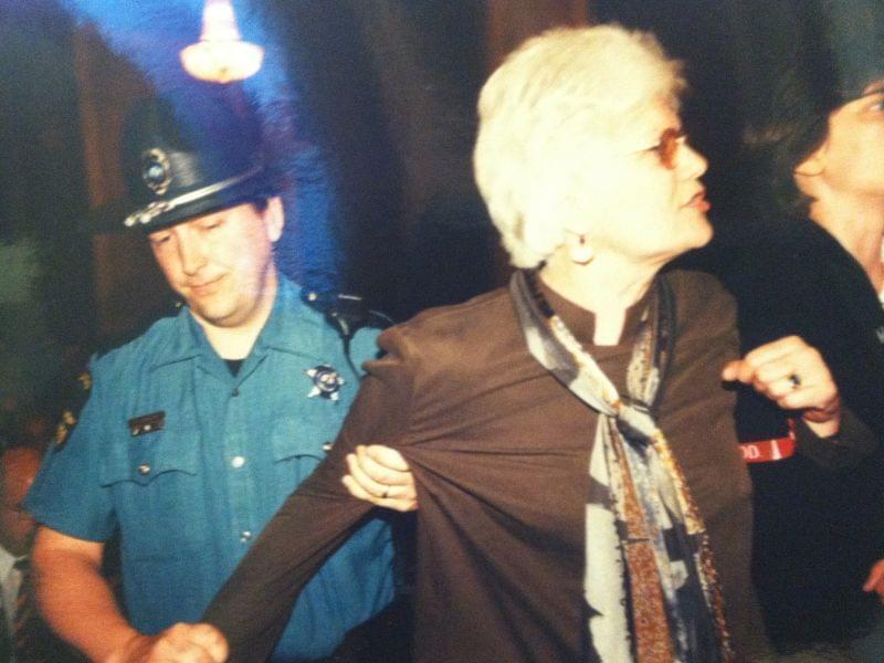 Mary Lee Sargent being arrested at a protest at the state capitol after a committee refused to allow a bill amending the human rights act on May 9, 2001.