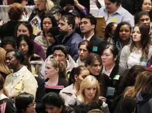 Job seekers attend a March health care job fair in New York.