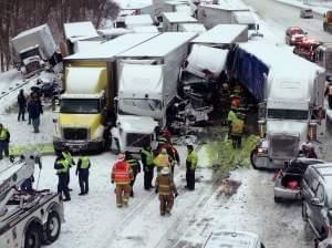 Emergency crews work at the scene of a massive pileup Thursday involving more than 40 vehicles, many of them semitrailers, along Interstate 94.