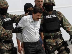 Mexican Marines escort Joaquin "El Chapo" Guzman to a helicopter in Mexico City on Saturday.