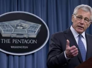Defense Secretary Chuck Hagel briefs reporters at the Pentagon on Monday. Hagel and President Obama will need to fight through a wall of resistance to their proposed defense budget cuts, say former members of a defense base closing commission.