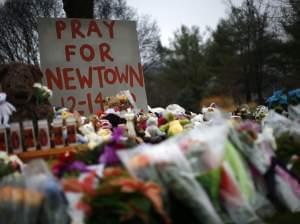 Flowers, candles and stuffed animals at a makeshift memorial in Newtown, Conn., the week after 20 children and 6 adults were killed at Sandy Hook Elementary School.