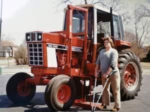Chip Petrea stands near a modified tractor after his accident.