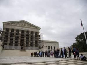 People wait in line for the beginning of the Supreme Court 2013-2014 opening term in Washington, on Oct. 7, 2013. They heard the first major case on campaign contribution limits since the landmark 2010 Citizens United.