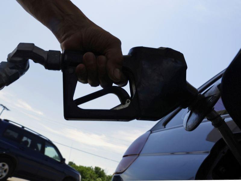 In this June 11, 2013, file photo, a motorist puts fuel in his car&#039;s gas tank at a service station in Springfield, Ill.