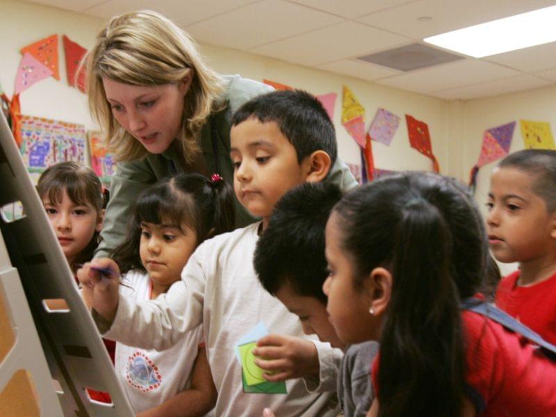 Denise Wiktor works with preschool students at the Shiloh School in downtown Waukegan, Ill., Tuesday, April 18, 2006. 