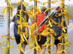 Yellow ribbons hang from a fence outside Danwon High School in Ansan, South Korea, as some students return Thursday for the first time since a ferry disaster claimed the lives of scores of their classmates.