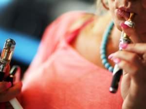 A woman tries electronic cigarettes at a store in Miami.